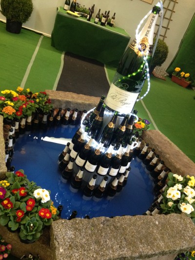 A champagne fountain with the biggest bottle I've ever seen. What even is that, a Balthazar?!